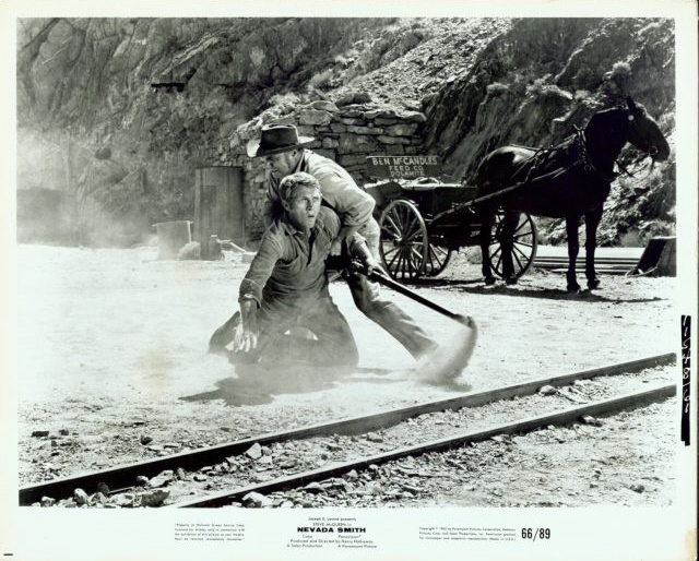 Ben McCandles (played by John Doucette) tries to stop 
Max (McQueen) from seeing his brutally murdered parents.